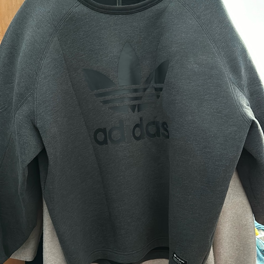 Adidas sweatshirt is new without tags. The sleeves are a little bubble sleeves